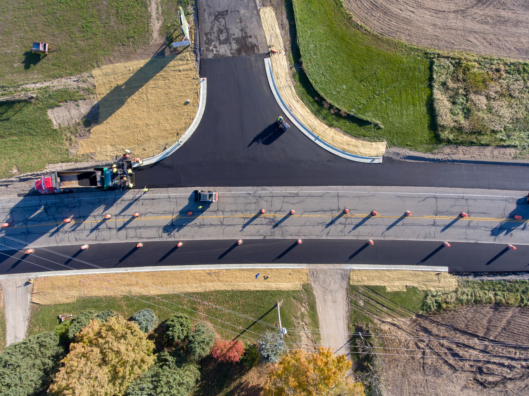 Overhead view of asphalt milling in progress on a country road